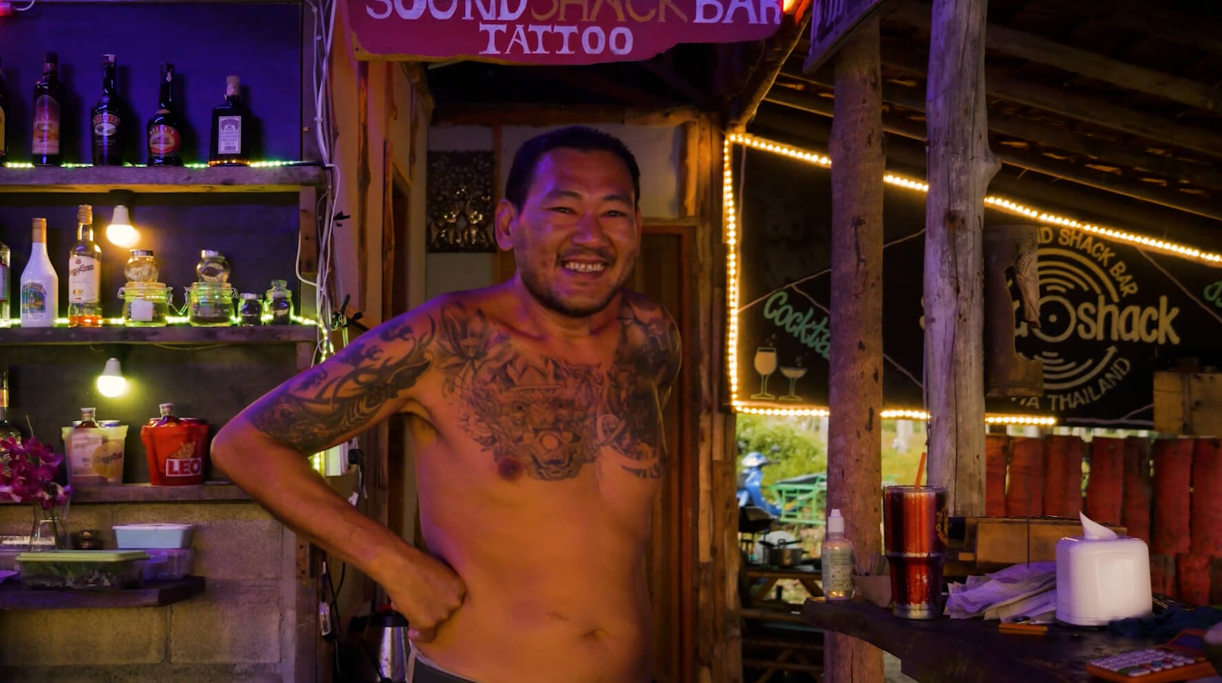 Ai smiling at the bar